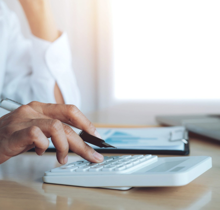 Finances Saveing Economy concept. Female accountant or banker use calculator.